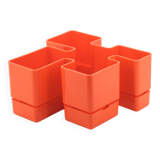 Vastill orange plastic planter by Michael McCann