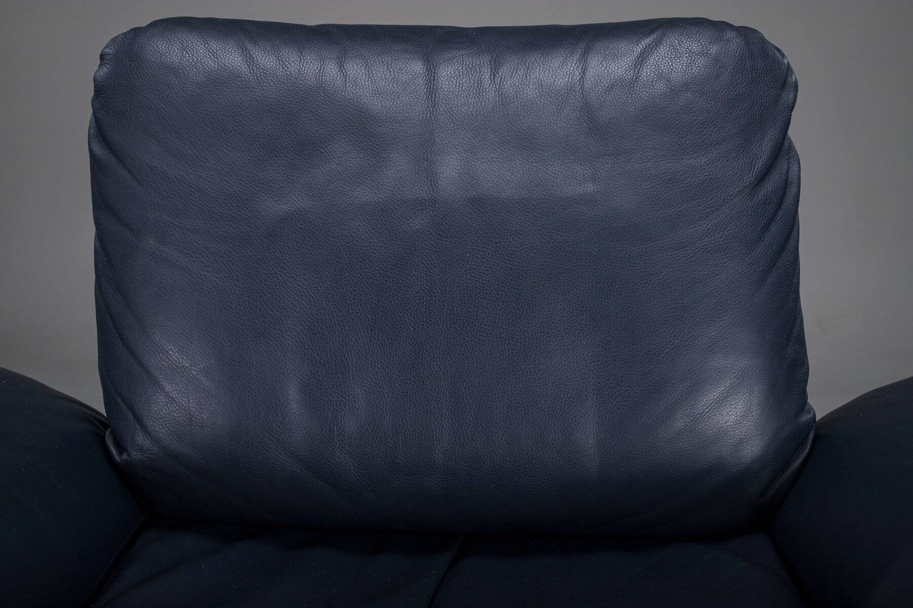 Danish teak and navy blue leather lounge chair from Komfort, 1970s