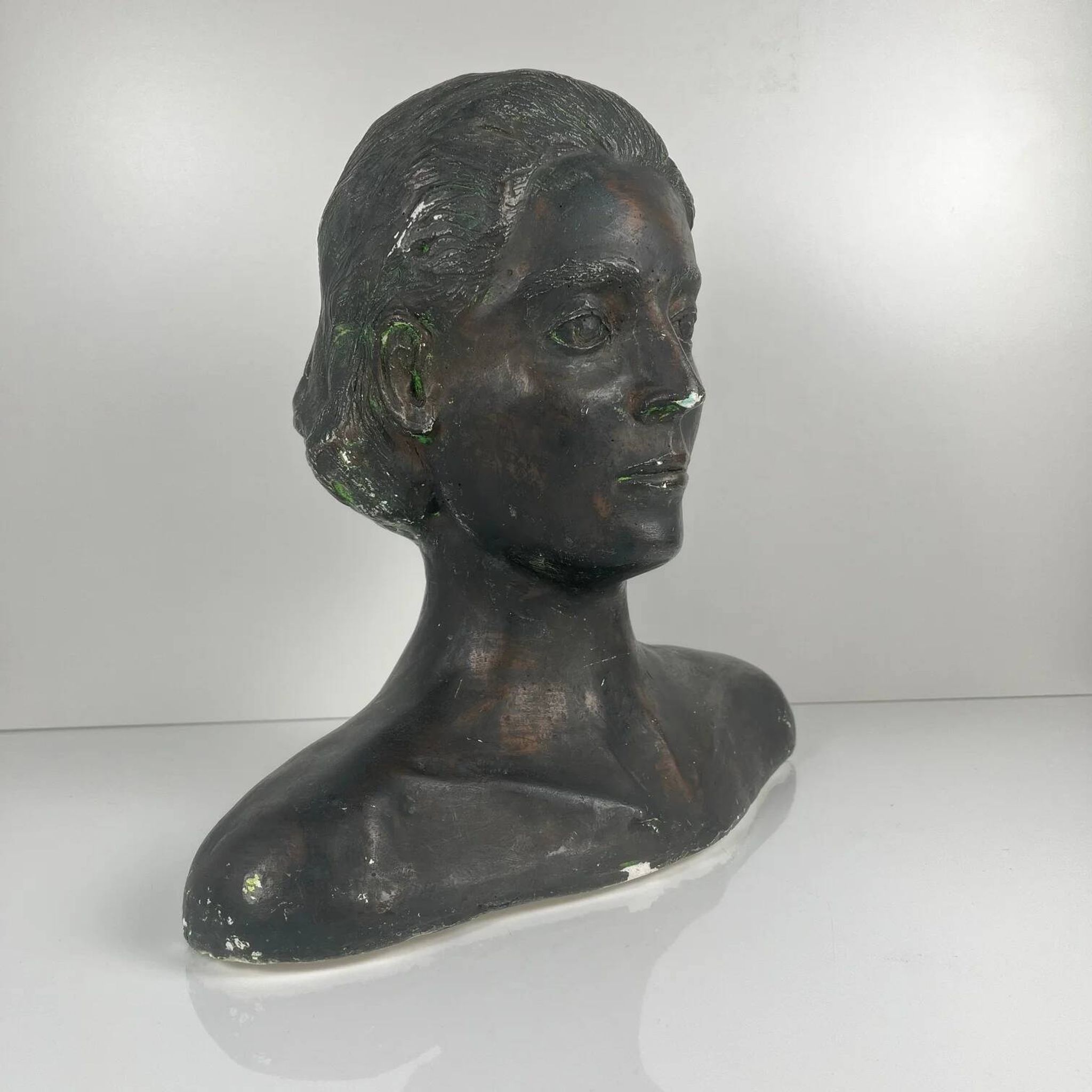 Female bust in neoclassical style in plaster by M. Mongey, 20th century.