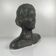 Female bust in neoclassical style in plaster by M. Mongey, 20th century.