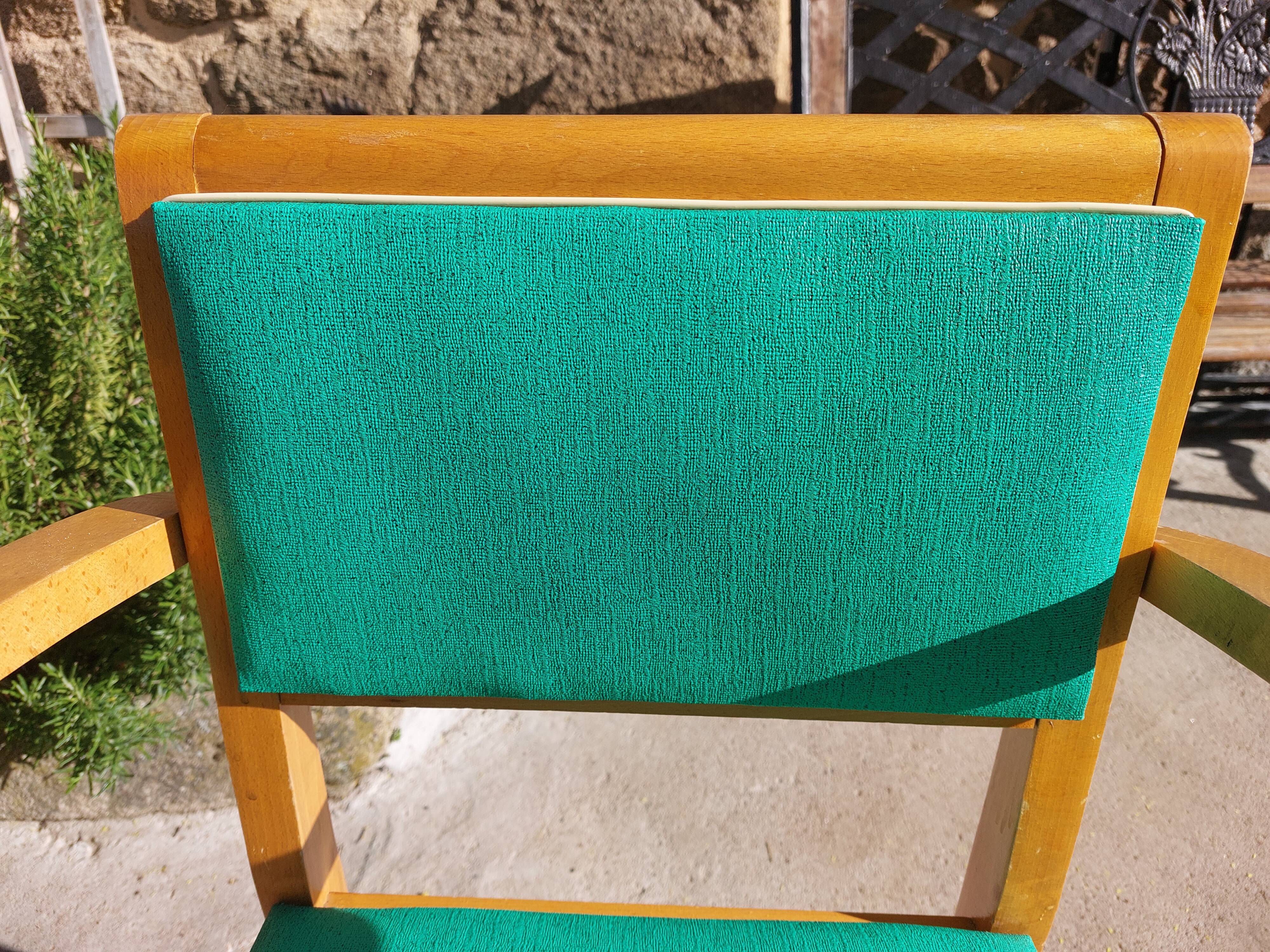 3 vintage bridge chairs with rounded armrests.