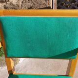 3 vintage bridge chairs with rounded armrests.