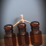 Trio round brown apothecary bottles