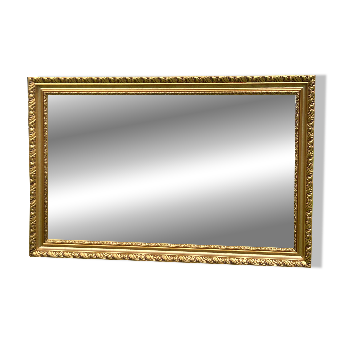 Large beveled mirror in wood and gilded stucco