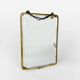 Old barber mirror in brass and beveled glass