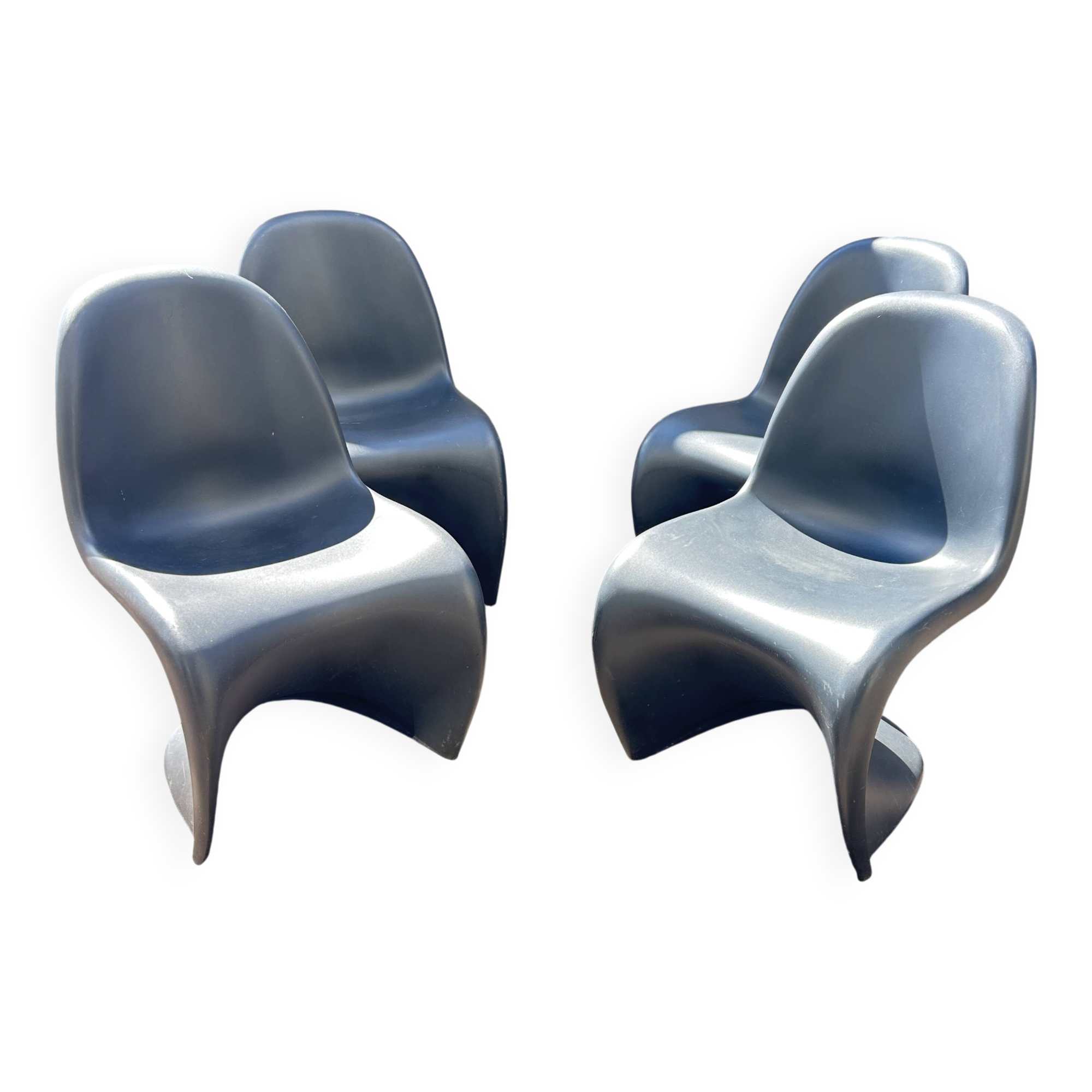 Set of 4 black Verner Panton Vitra chairs.