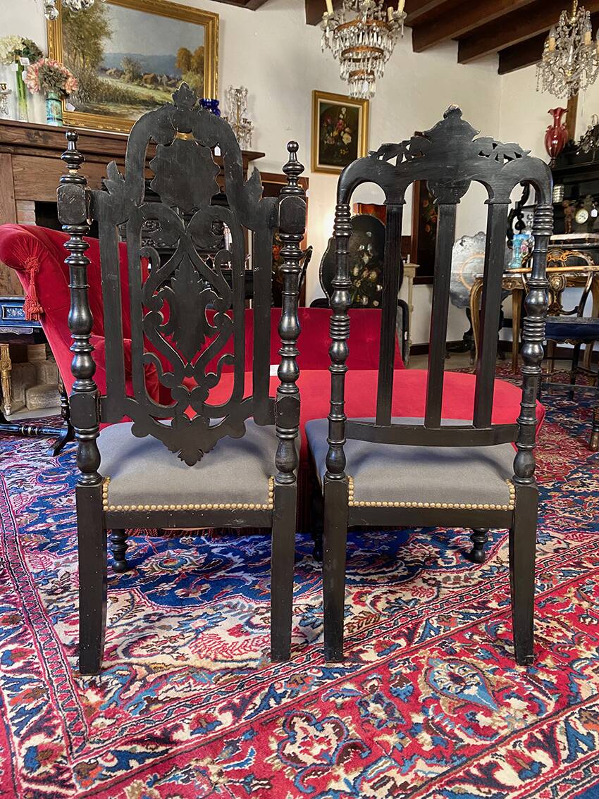 Fake pair of low Napoleon III chairs in blackened wood.