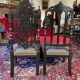 Fake pair of low Napoleon III chairs in blackened wood.