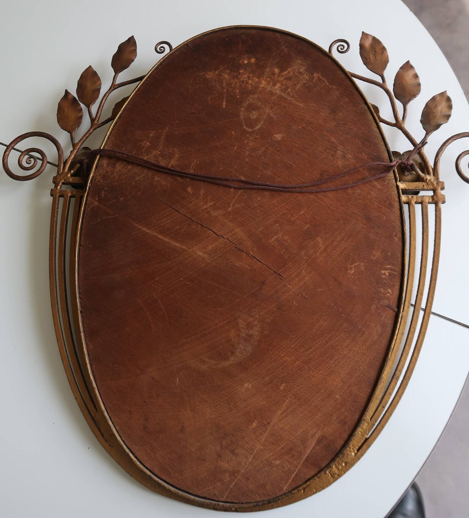 Art Deco mirror from the 1930s in hammered steel.