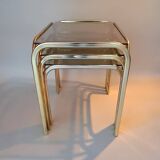 3 vintage golden nesting tables with smoked glass.