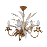 Vintage wrought iron chandelier decorated with golden and beige reeds