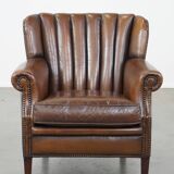 Sheep leather armchair finished with decorative nails