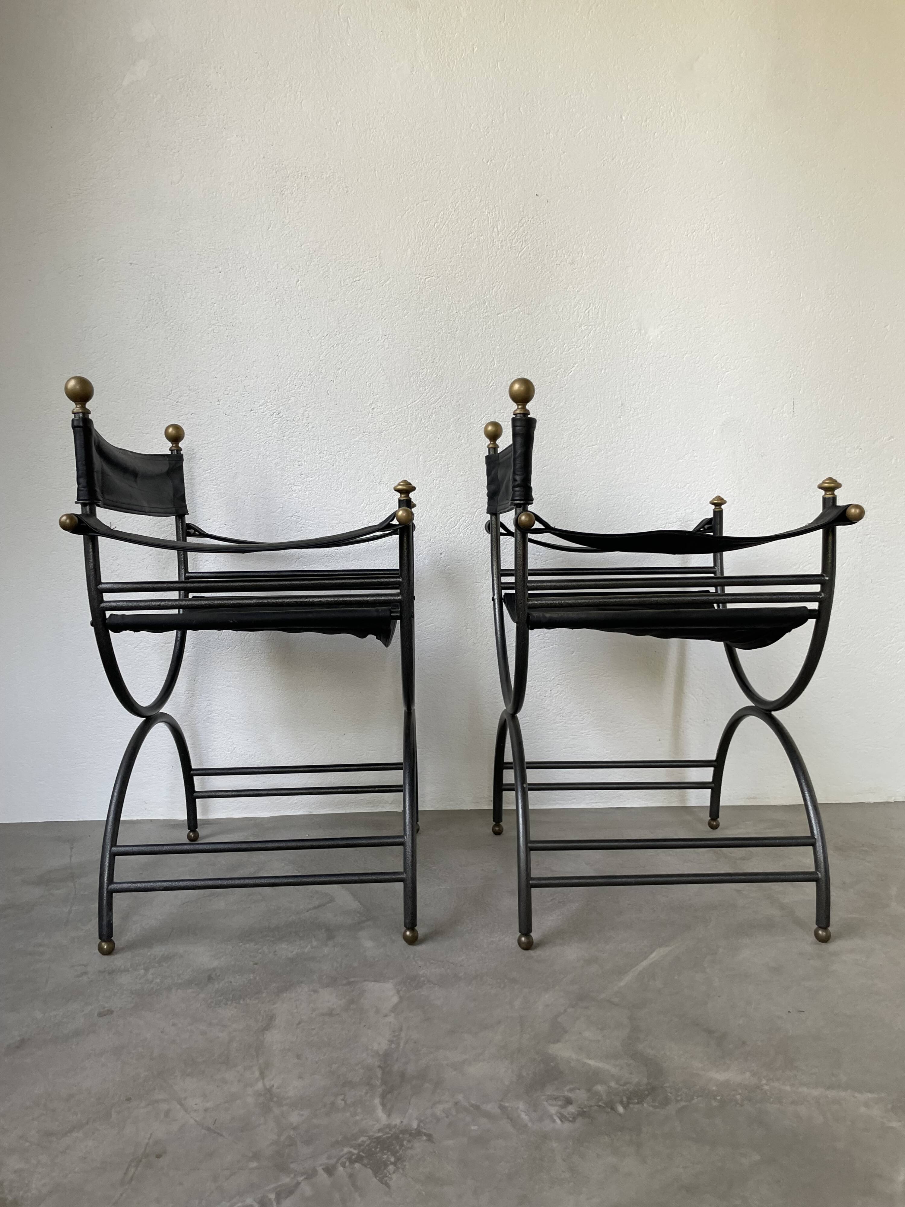 Pair of leather “curule” emperor armchairs