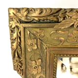 Large rectangular beveled mirror with gold stucco