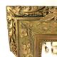 Large bevelled rectangular mirror with gilded stucco.