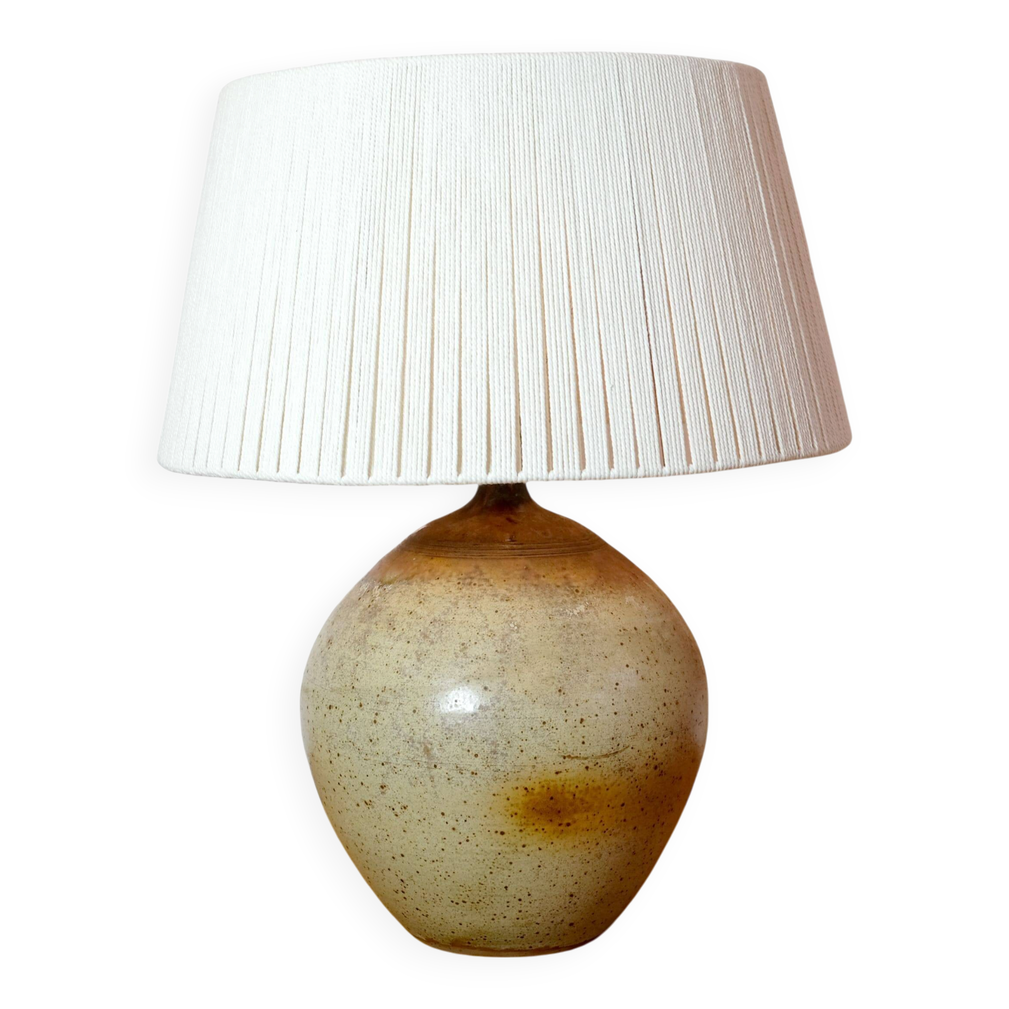 Large stone lamp with a cotton shade.