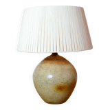 Large stone lamp with a cotton shade.