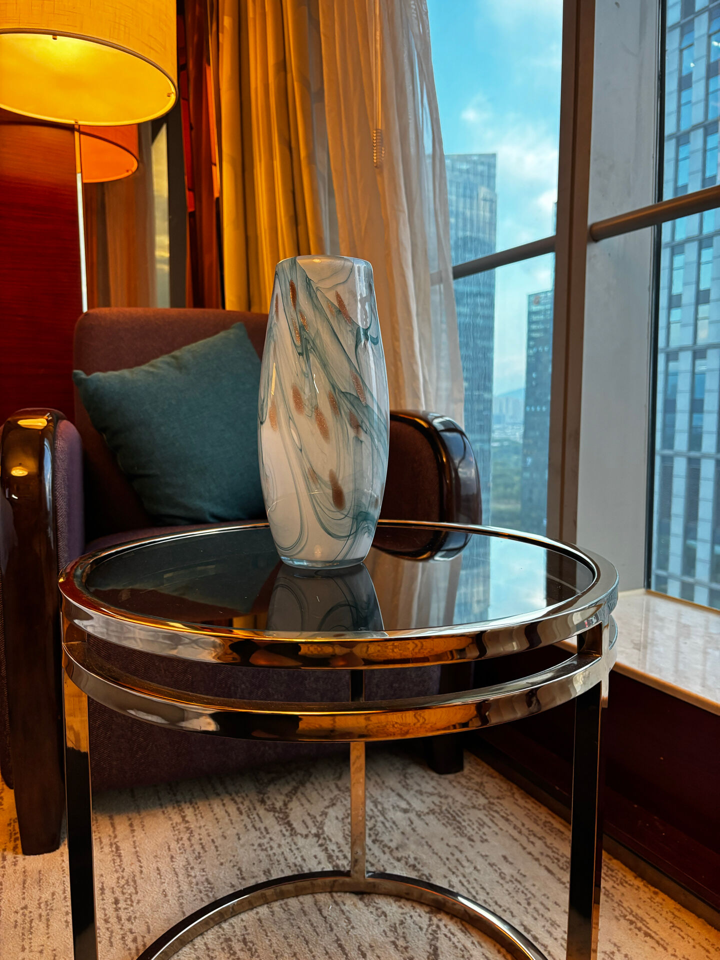 Blown glass vase marbled in white, water green, and with golden inclusions –
