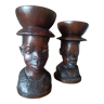 Bed of ethnic candlesticks African heads