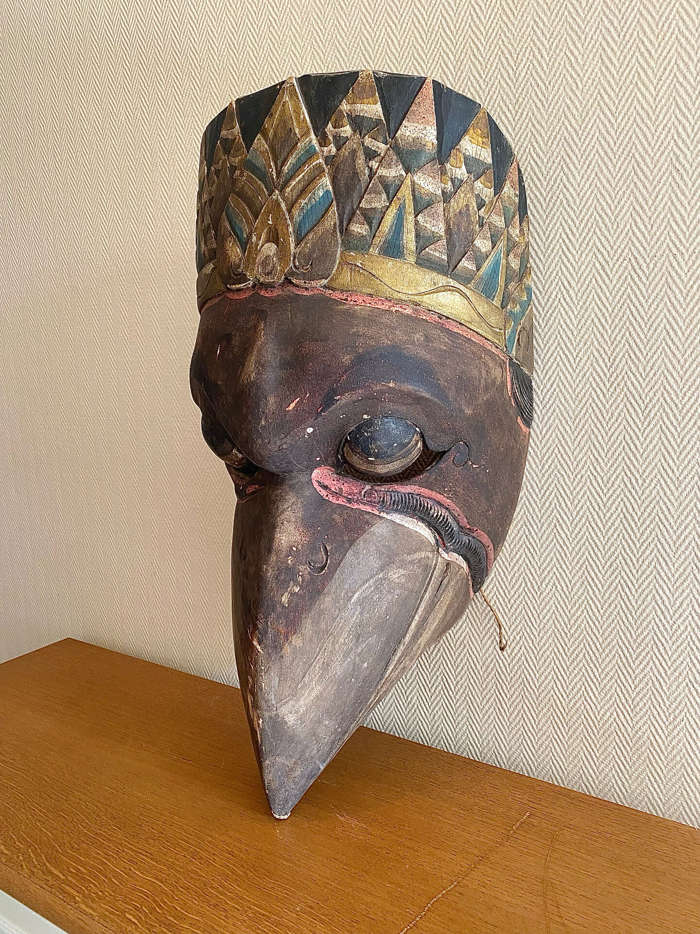 Grand traditional Indonesian mask carved from wood.