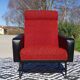 Vintage armchairs in red and black faux leather, the pair.