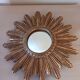 Miroir soleil vintage , en bois doré .