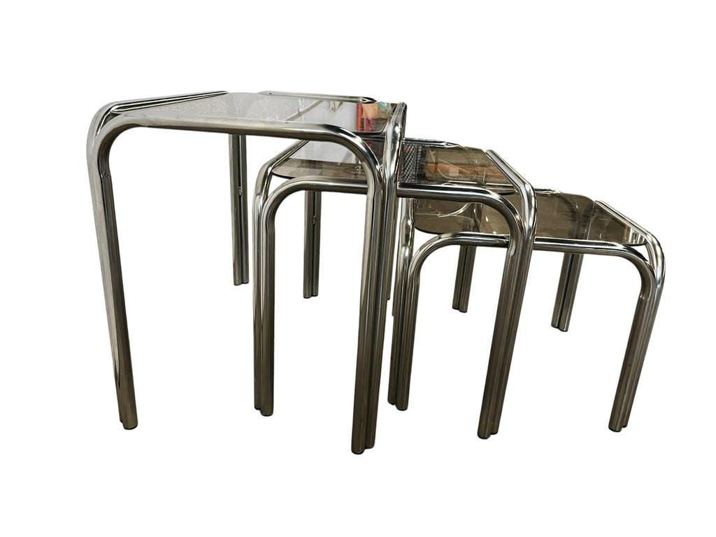 Set of 3 vintage chrome nesting tables with smoked glass.