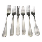 6 old mismatched silver metal forks for a chic table