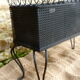 Black perforated metal planter from the 1950s