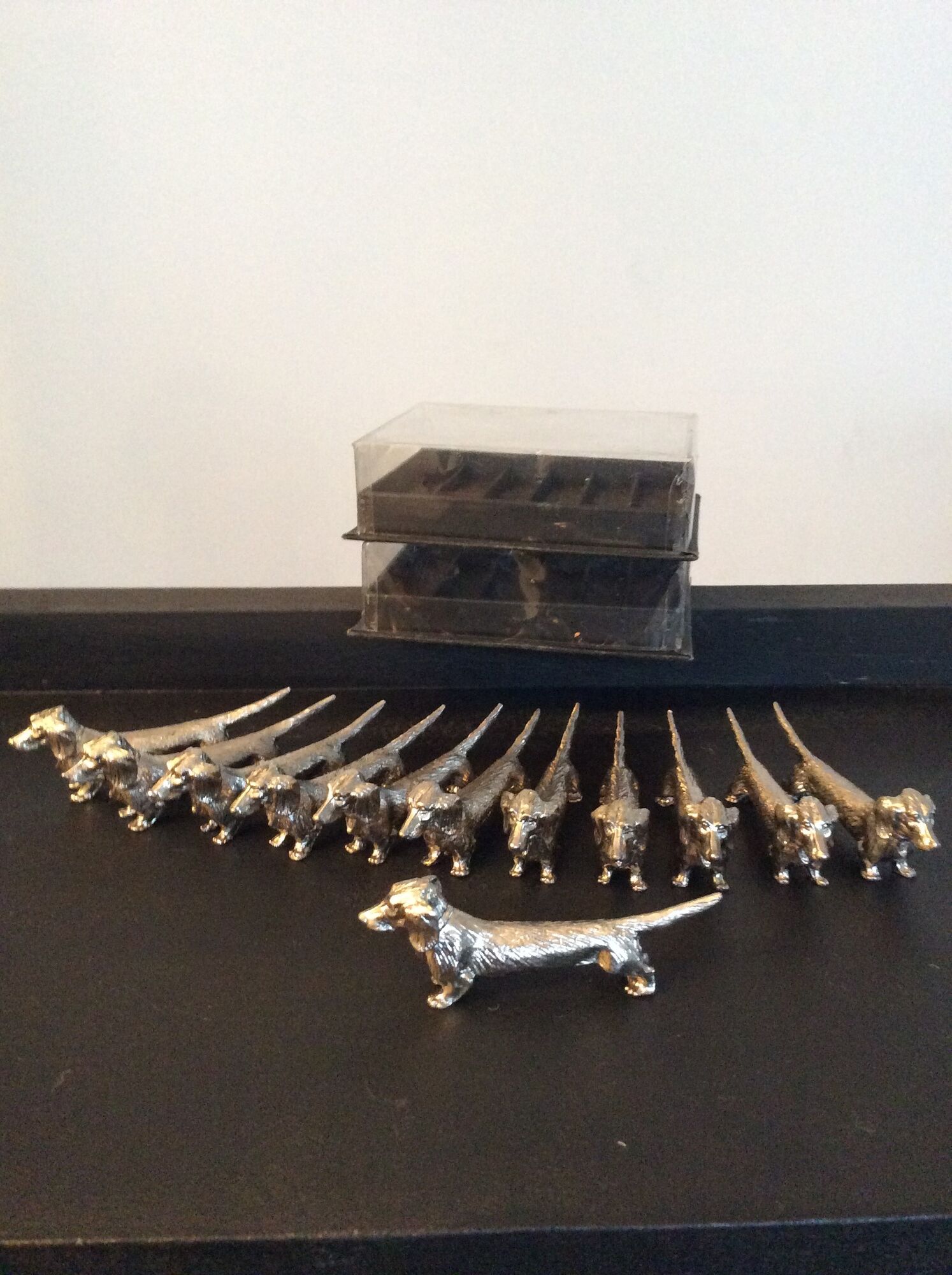 Series of 12 vintage dachshund knife holders in silver metal