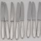 Christofle Rubans, 10 silver-plated table knives, in excellent condition.