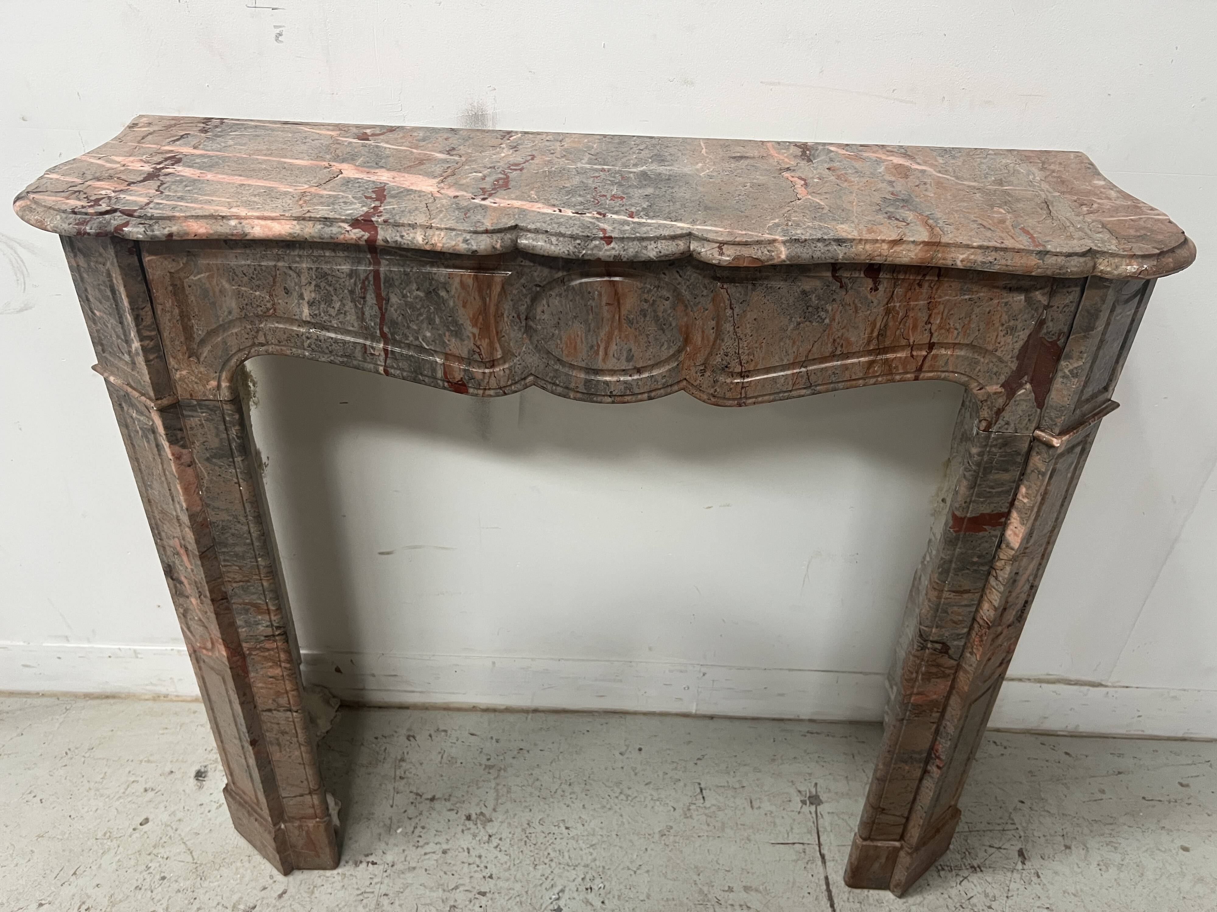 Louis XV style fireplace, "Pompadour" model, grey-pink marble, 20th century