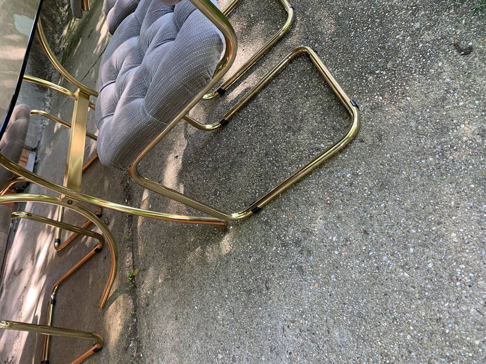 1970s table set with 4 chairs in gold brass and grey fabric, smoked glass top.