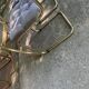 1970s table set with 4 chairs in gold brass and grey fabric, smoked glass top.