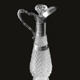 Diamond-point molded glass ewer, silver-plated metal.