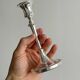 Pair of white metal candlesticks