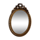 Louis xvi style oval mirror decorated with ribbons