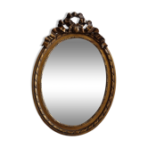 Miroir ovale de style louis xvi à décor de rubans