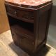 Solid oak bedside table with brown and white marble.