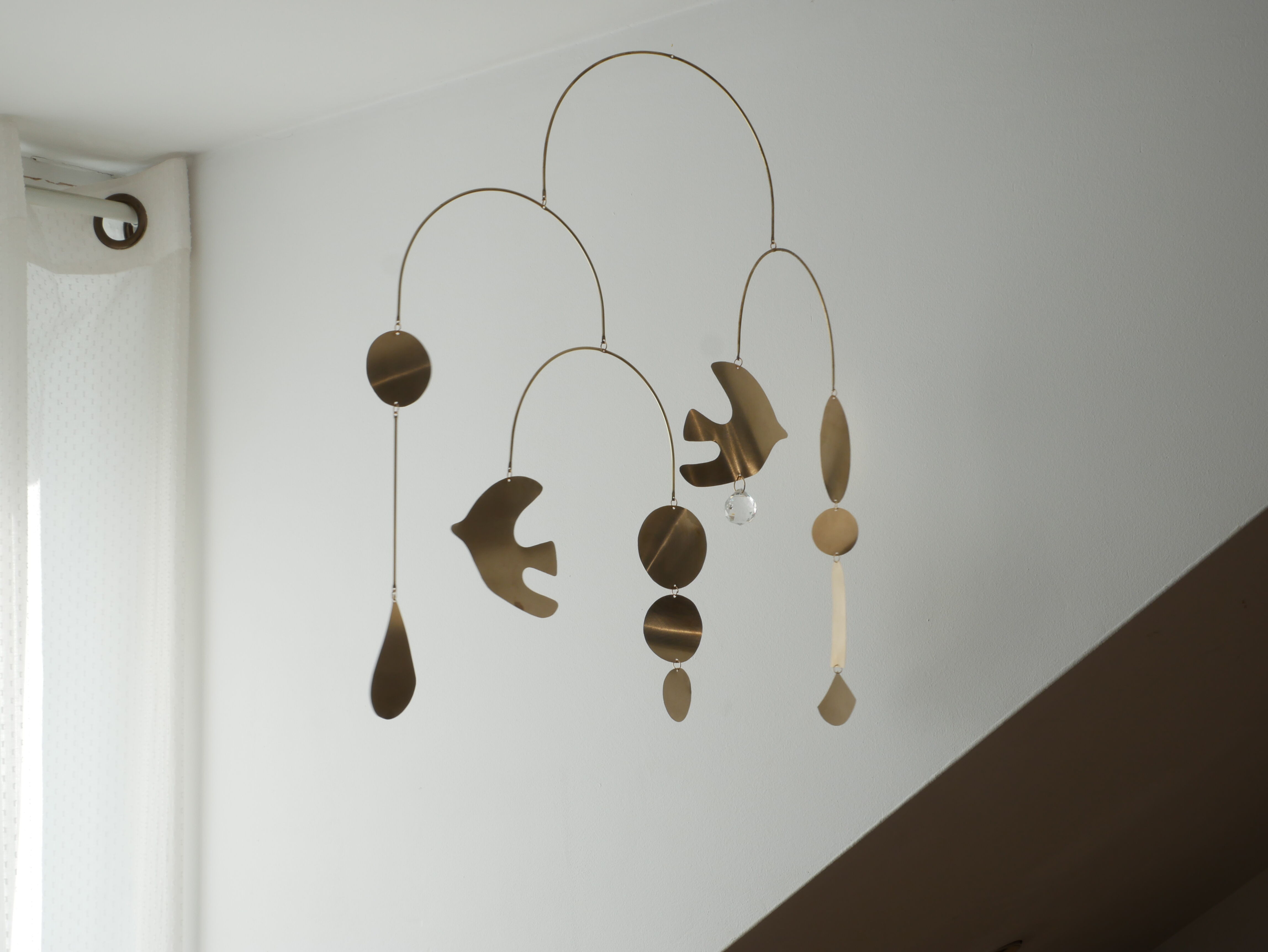 Mobile model Rana . Mobile in abstract brass.