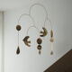 Mobile model Rana . Mobile in abstract brass.