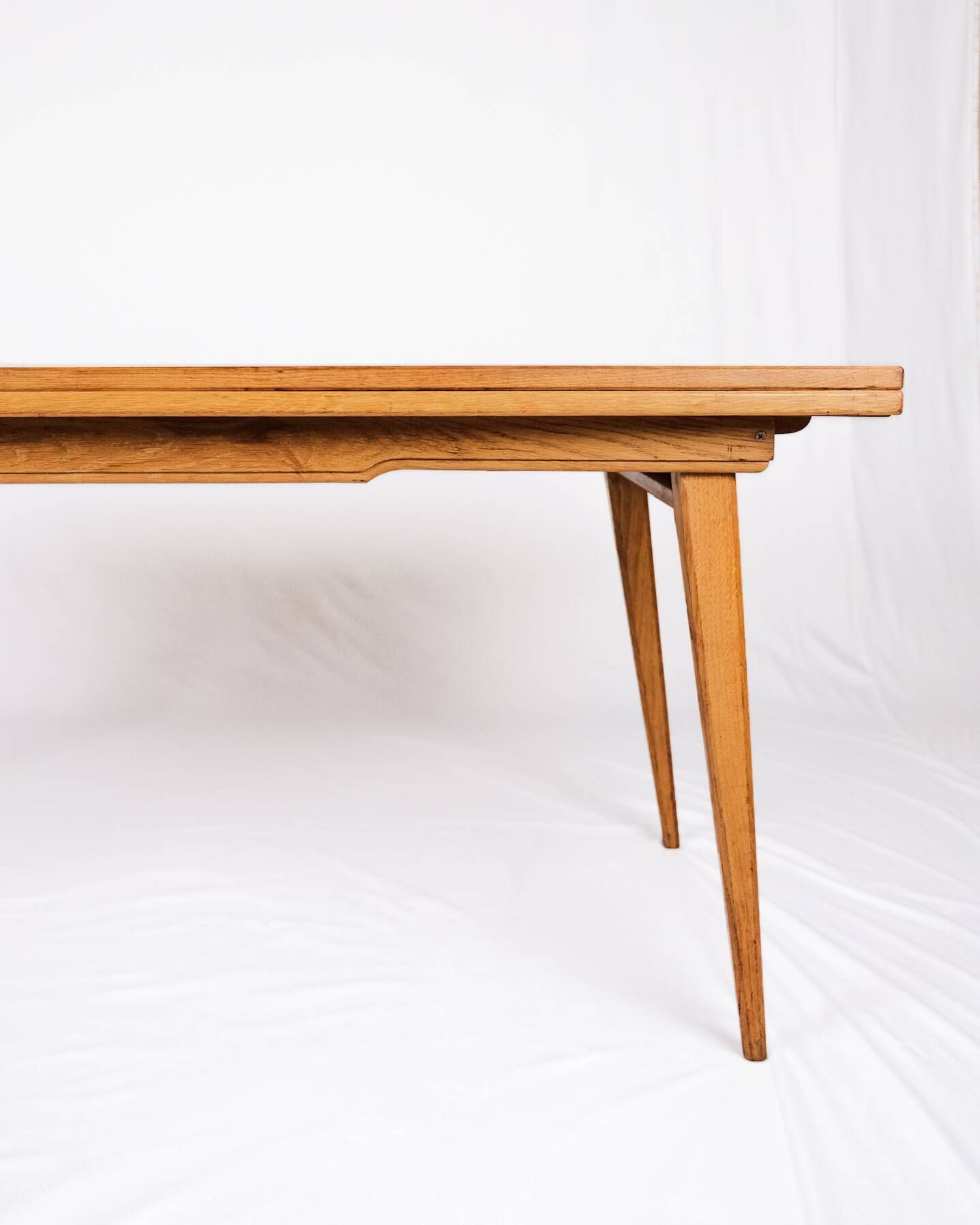 Extendable oak table in the style of Guillerme and Chambron, France 1960s