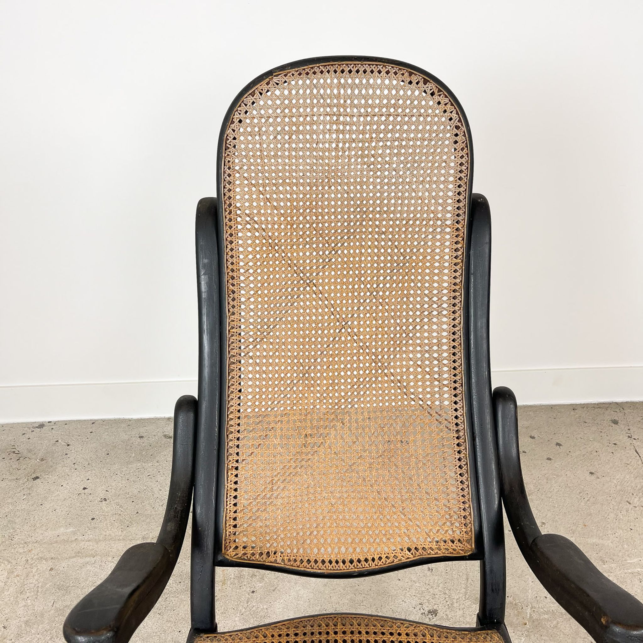 Antique black bentwood and cane lounge armchair by Thonet 19th century