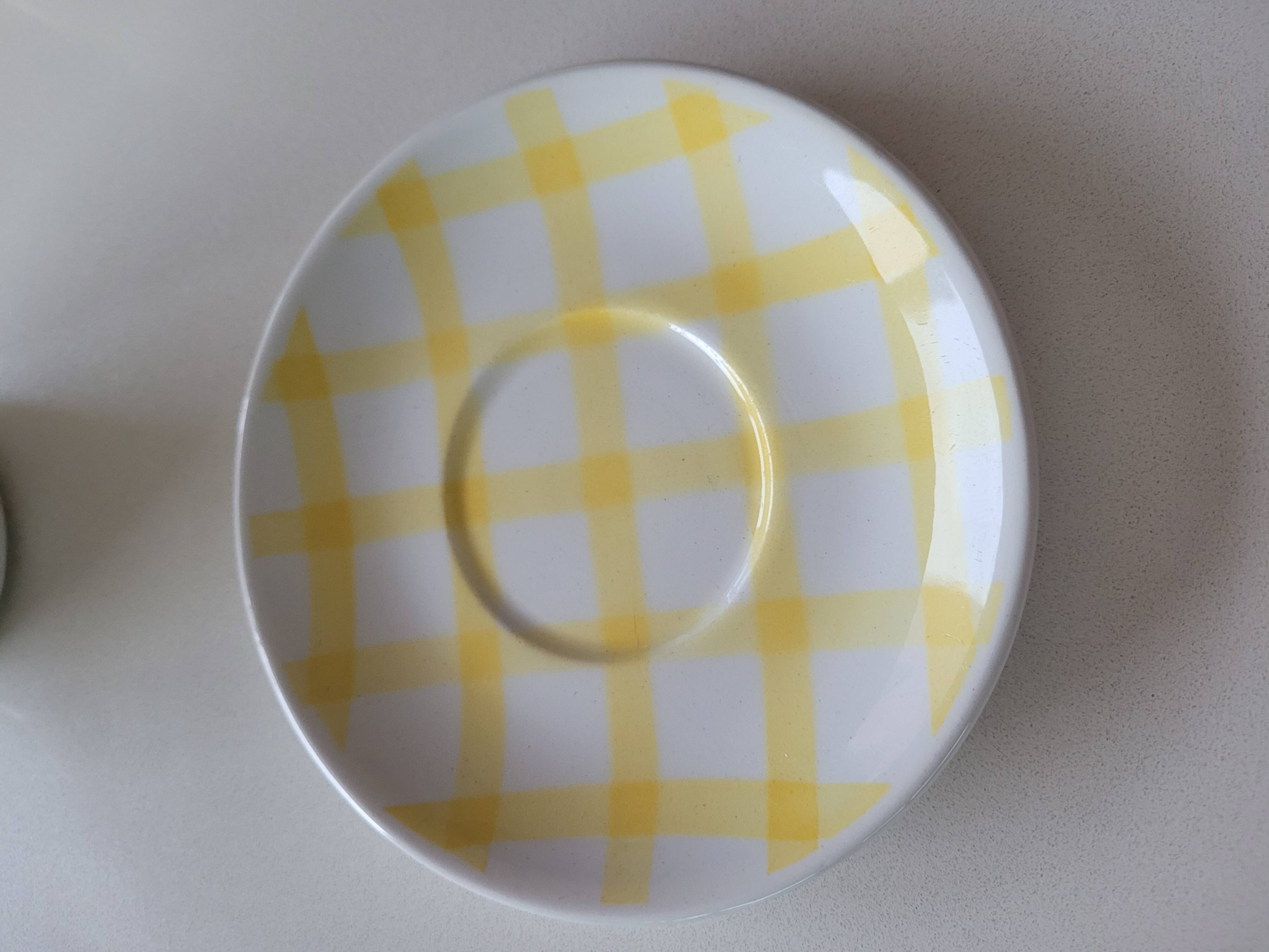 4 cups, 2 under cups yellow and white tea towel pattern