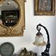 Art Nouveau wall light in wrought iron with vine decoration, early 20th century.