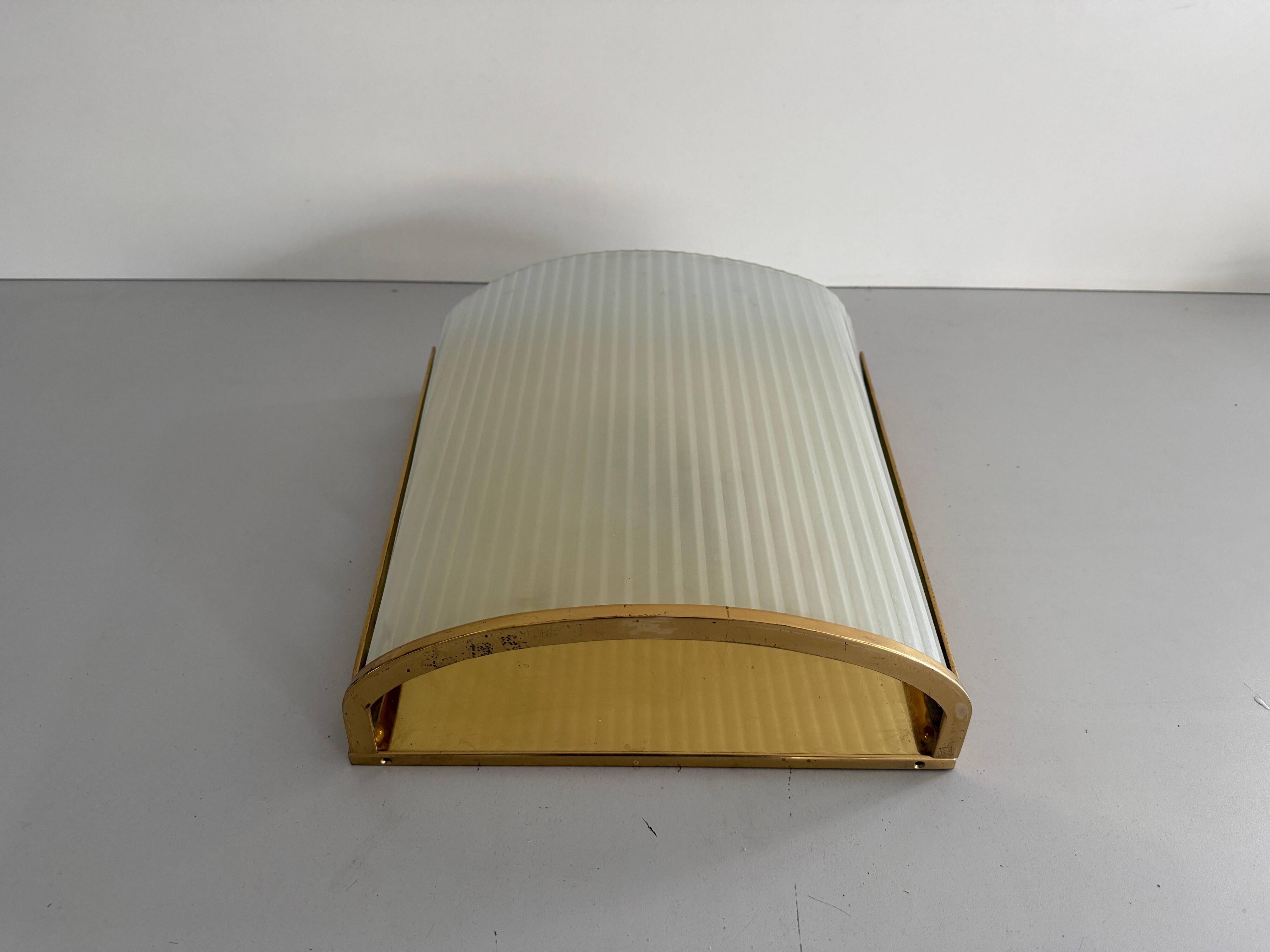 Large heavy glass wall light with a brass frame from the mid-century, 1950s, Italy.