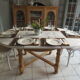 Round table with 1 extension oak base tray and patinated extension pearl gray.