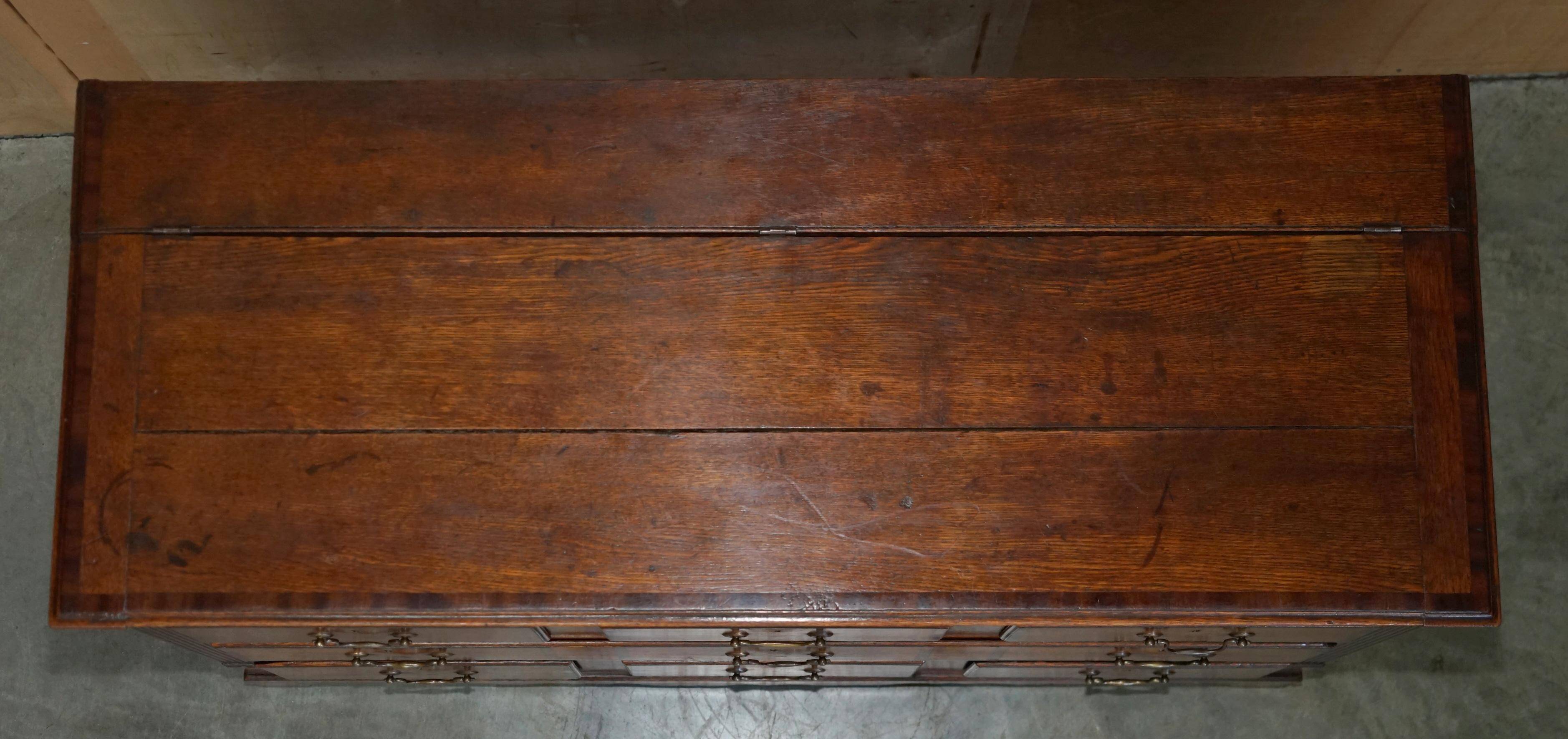 Georgian oak commode with a folding top, English, 18th century.