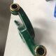 Art Deco candlestick in green and gold earthenware.