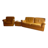 Tan leather sofa with natural graining, matching armchair and pouf